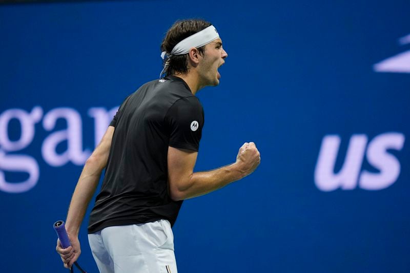 Taylor Fritz, of the United States, reacts against Frances Tiafoe, of the United States, during the men's singles semifinals of the U.S. Open tennis championships, Friday, Sept. 6, 2024, in New York. (AP Photo/Seth Wenig)