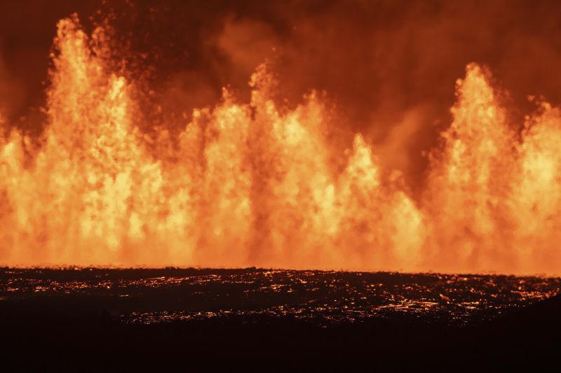 View of the lava fountains pouring out from the new eruptive fissure opened at Svartsengi volcanic system, Iceland, Thursday, Aug. 22, 2024, in a similar location as the previous eruptions. The fissure is 3 km north of Grindavik. (AP Photo/Marco di Marco)