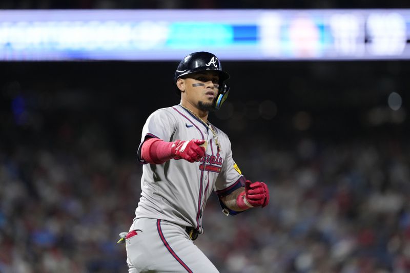 Atlanta Braves' Orlando Arcia reacts after hitting a home run against Philadelphia Phillies pitcher Max Lazar during the sixth inning of a baseball game, Friday, Aug. 30, 2024, in Philadelphia. (AP Photo/Matt Slocum)