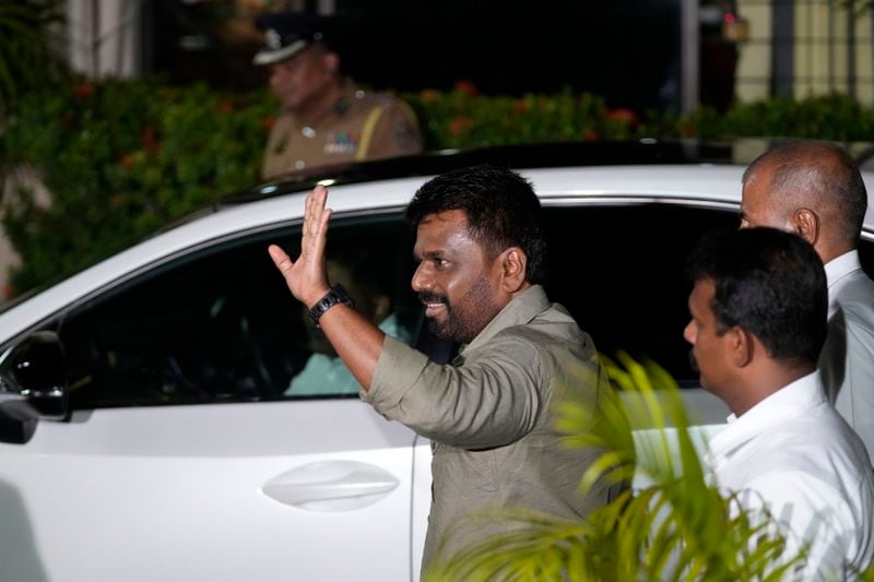 Marxist lawmaker Anura Kumara Dissanayake waves as he arrives at the election commission office after winning Sri Lankan presidential election, in Colombo, Sri Lanka, Sunday, Sept. 22, 2024. (AP Photo/Eranga Jayawardane)