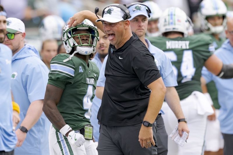 Tulane head coach Jon Sumrall celebrates a touchdown by wide receiver Mario Williams (4) during the first half of an NCAA college football game against Kansas State in New Orleans, Saturday, Sept. 7, 2024. (AP Photo/Matthew Hinton)