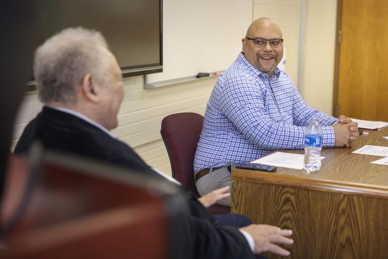 Steven Allwood, center, listens as his father Vernon Allwood speaks during the Eddie Gaffney lecture series about mental health at Dansby Hall on the Morehouse College campus, Tuesday, October 17, 2023, in Atlanta. (Jason Getz / Jason.Getz@ajc.com)