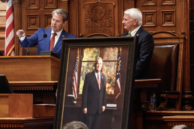 Gov. Brian Kemp gives remarks Thursday as Speaker Jon Burns looks on after the unveiling of a portrait of the late House Speaker David Ralston on what would have been his 70th birthday. (Natrice Miller/ Natrice.miller@ajc.com)