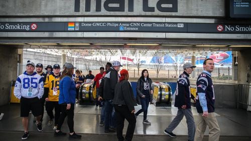 Passengers arrive at the Georgia World Congress Center MARTA stop before the Super Bowl 53 football game between the Los Angeles Rams and New England Patriots, Sunday, Feb. 3, 2019, in Atlanta. BRANDEN CAMP/SPECIAL