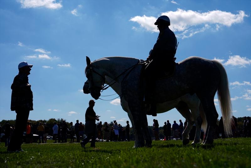 Mounted police watch as supporters arrive before Republican presidential nominee former President Donald Trump speaks at a campaign rally at the Butler Farm Show, Saturday, Oct. 5, 2024, in Butler, Pa. (AP Photo/Julia Demaree Nikhinson)