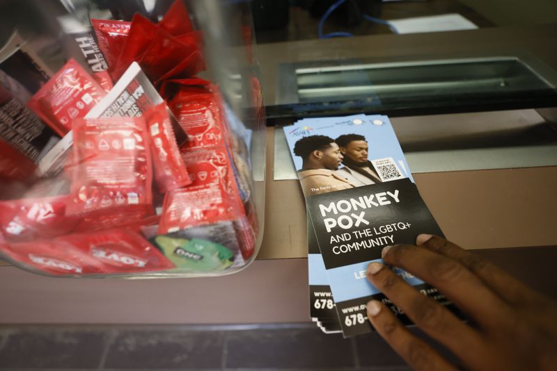 At the office entrance, clients can find vital information and prevention material for the community, like monkeypox pamphlets and condoms.  Miguel Martinez / miguel.martinezjimenez@ajc.com