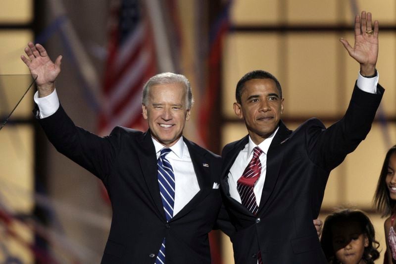 FILE - Democratic presidential nominee Sen. Barack Obama, D-Ill., left, and his running mate, Sen. Joe Biden, D-Del., wave after Obama's acceptance speech at the Democratic National Convention, Aug. 28, 2008, in Denver. (AP Photo/Ron Edmonds, File)