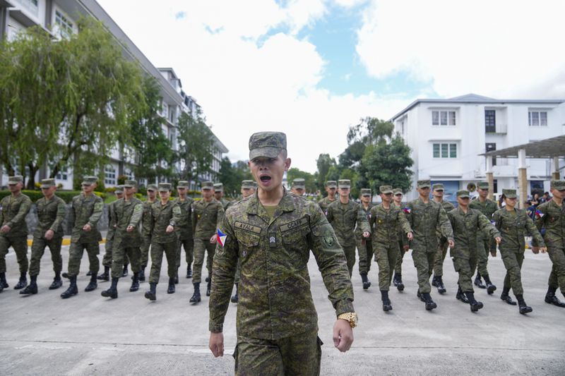 Cadets of the Philippine Military Academy march in formation at Fort Gregorio Del Pilar in Baguio, northern Philippines on Thursday, Aug. 29, 2024. (AP Photo/Aaron Favila)