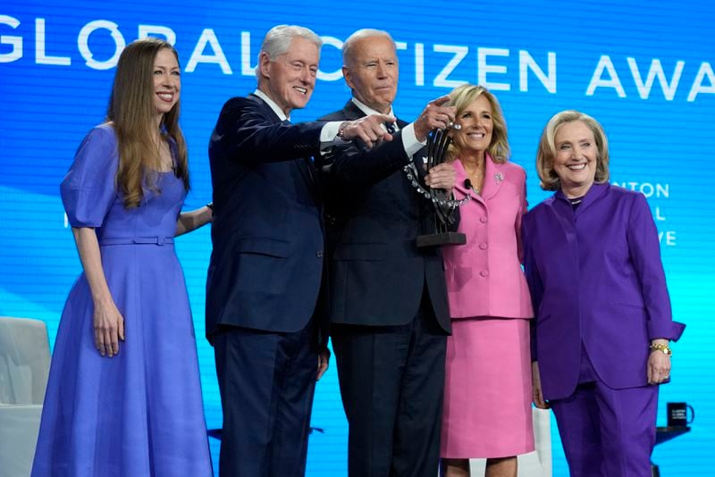 President Joe Biden is presented with the Global Citizen Award by Chelsea Clinton, former President Bill Clinton, first lady Jill Biden and former Secretary of State Hillary Clinton at the Clinton Global Initiative Monday, Sept. 23, 2024, in New York. (AP Photo/Manuel Balce Ceneta)