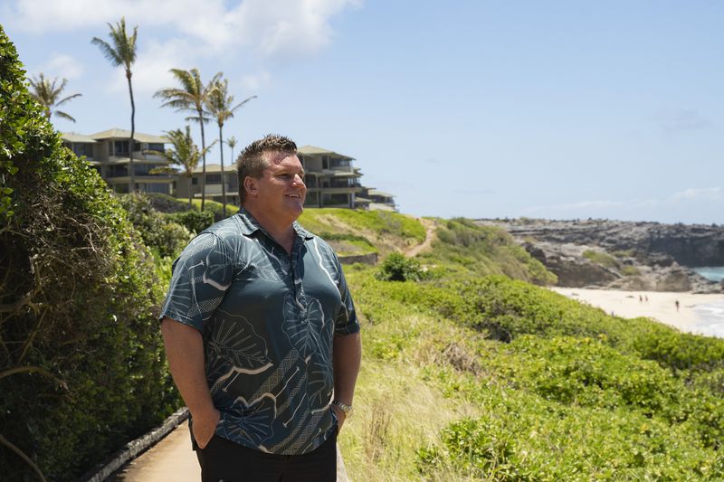 Jeremy Stice, who manages more than 40 vacation rental properties, poses for a portrait at The Ridge Villas on Monday, June 24, 2024, in Lahaina, Hawaii. The mayor of Maui County in Hawaii wants to stop owners of thousands of vacation properties from renting to visitors. Instead, he wants the units rented long-term to people who live on Maui to address a chronic housing shortage that intensified after last August’s deadly wildfire. (AP Photo/Mengshin Lin)