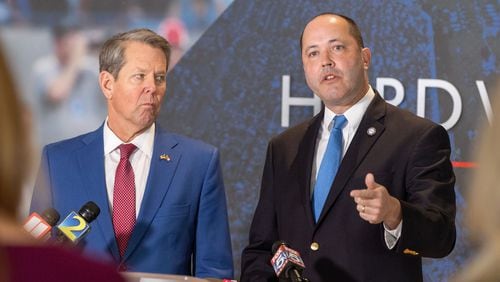 Georgia Attorney General Chris Carr (right), a Republican, announced Wednesday that he has added the state to a federal lawsuit against one of President Joe Biden's new college debt relief programs. Gov. Brian Kemp and Carr spoke to media after an anti-gang summit at Georgia State University in Atlanta on Feb. 7, 2023. (Arvin Temkar/The Atlanta Journal-Constitution/TNS)