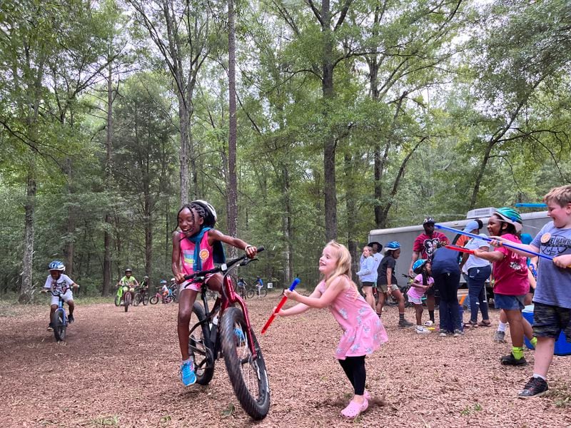 It would take years to build the 211-mile Georgia Hi-Lo Trail. So trail proponent Mary Charles Howard launched the Kids Bike League. The program teaches kids in nearby communities how to ride and creates dirt paths for them to ride on at league camps. (Matt Kempner / mkempner@ajc.com)