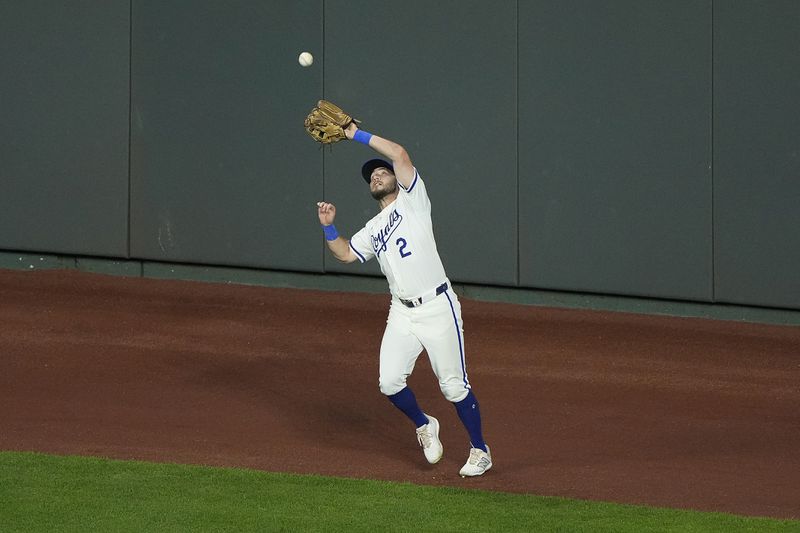 Kansas City Royals center fielder Garrett Hampson catches a fly ball for the out on Detroit Tigers' Trey Sweeney during the sixth inning of a baseball game Wednesday, Sept. 18, 2024, in Kansas City, Mo. (AP Photo/Charlie Riedel)