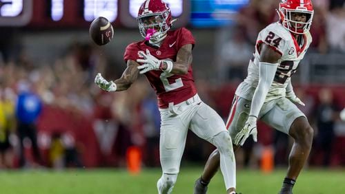 Alabama wide receiver Ryan Williams (2) makes a difficult bobbled catch with Georgia defensive back Malaki Starks (24) defending during the second half of an NCAA college football game, Saturday, Sept. 28, 2024, in Tuscaloosa, Ala. (AP Photo/Vasha Hunt)