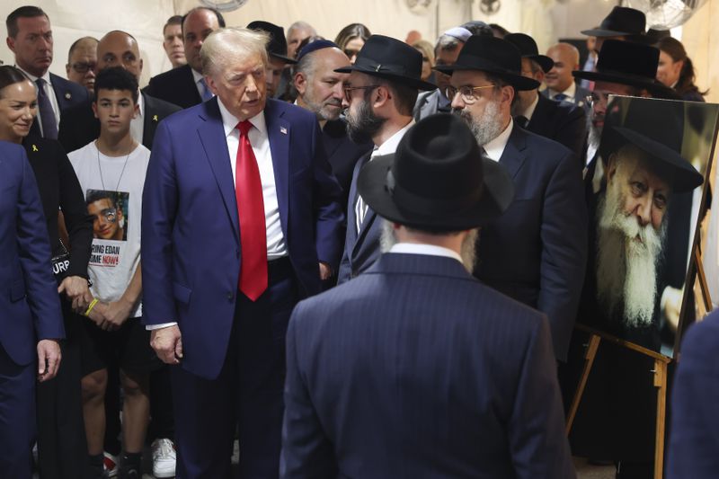 Republican presidential nominee former President Donald Trump arrives at Ohel Chabad-Lubavitch to visit the gravesite of Rabbi Menachem Mendel Schneerson, Monday, Oct. 7, 2024, in New York. (AP Photo/Yuki Iwamura)