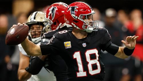 Atlanta Falcons quarterback Kirk Cousins (18) works against the New Orleans Saints during the first half of an NFL football game, Sunday, Sept. 29, 2024, in Atlanta. (AP Photo/Butch Dill)