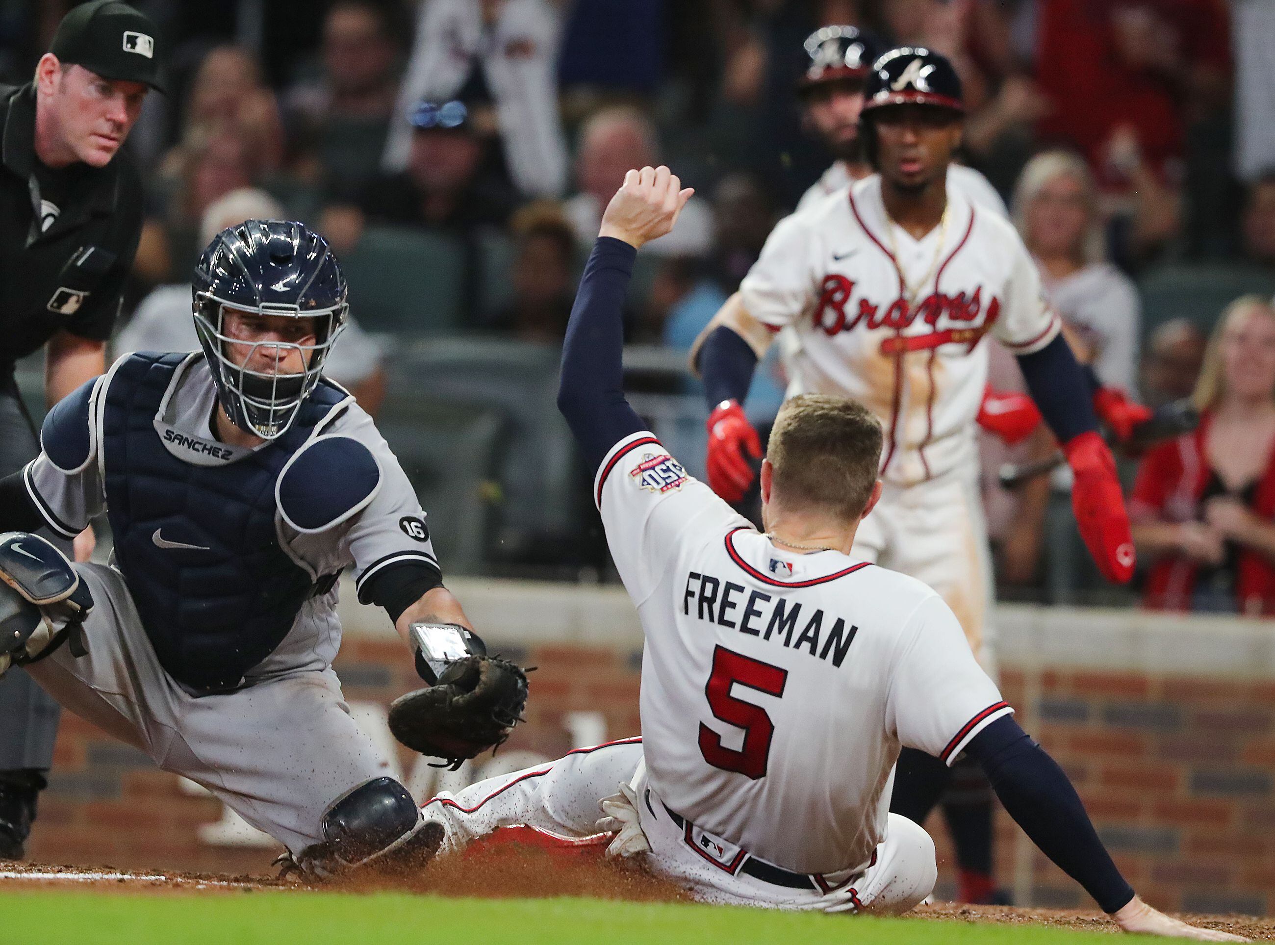 Phillies score a run vs. Braves on controversial catcher's