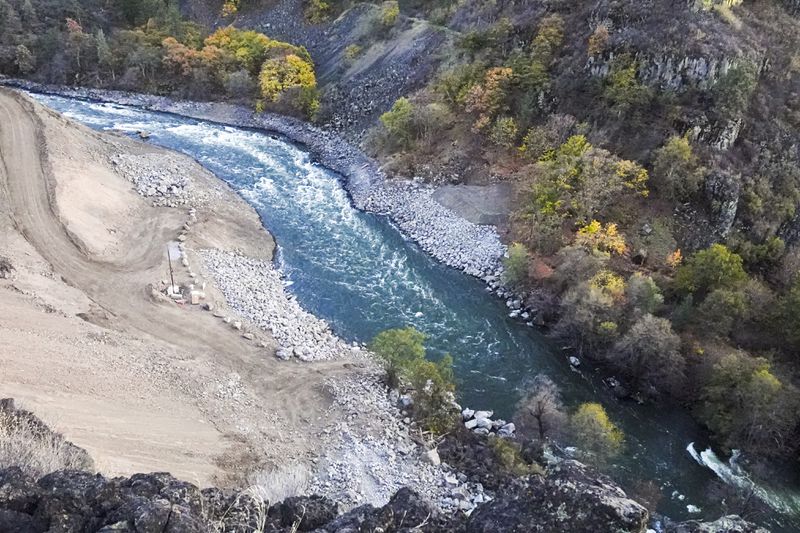 In this October 2023 image provided by Swiftwater Films shows water flowing down the Klamath River where the dam known as Copco 2 once stood in Siskiyou County, Calif. (Swiftwater Films via AP)