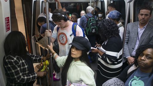 Travelers ride on the plane train on Friday, December 9, 2022, at Hartsfield Jackson International airport in Atlanta.CHRISTINA MATACOTTA FOR THE ATLANTA JOURNAL-CONSTITUTION.