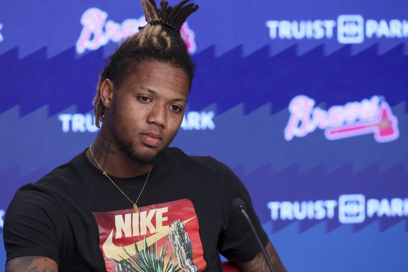 Atlanta Braves right fielder Ronald Acuña Jr. listens as his interpreter Franco Garcia (not pictured) translates his answers to members of the media before the Braves game against the Washington Nationals at Truist Park, Thursday, May 30, 2024, in Atlanta. Acuña suffered a torn ACL in his left knee during Sunday’s game against the Pirates in Pittsburgh. He will undergo season-ending surgery. (Jason Getz / AJC)
