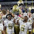 Georgia Tech players celebrate after beating Duke 24-14 at Bobby Dodd Stadium in Atlanta on Saturday, October 5, 2024. (Arvin Temkar / AJC)