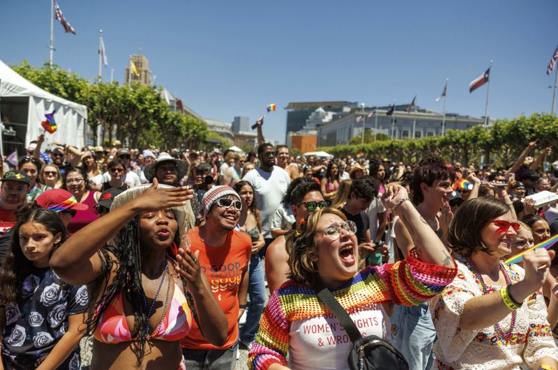 Revelers cheers during a Pride Parade, Sunday, June 30, 2024, in San Francisco. (AP Photo/Ethan Swope)