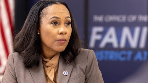 Fulton County District Attorney Fani Willis listens during a press interview at the district attorney’s office in Atlanta on Friday, July 12, 2024. Public safety officials presented findings from a report on repeat offenders. (Arvin Temkar / AJC)