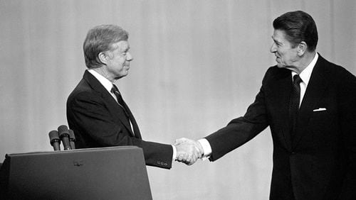 Jimmy Carter, left, faced a tough bid for reelection in 1980, when he lost to Ronald Reagan. Former U.S. Rep. Michael Barnes reflects on Carter's campaign that year, drawing parallels to President Joe Biden's run for reelection.