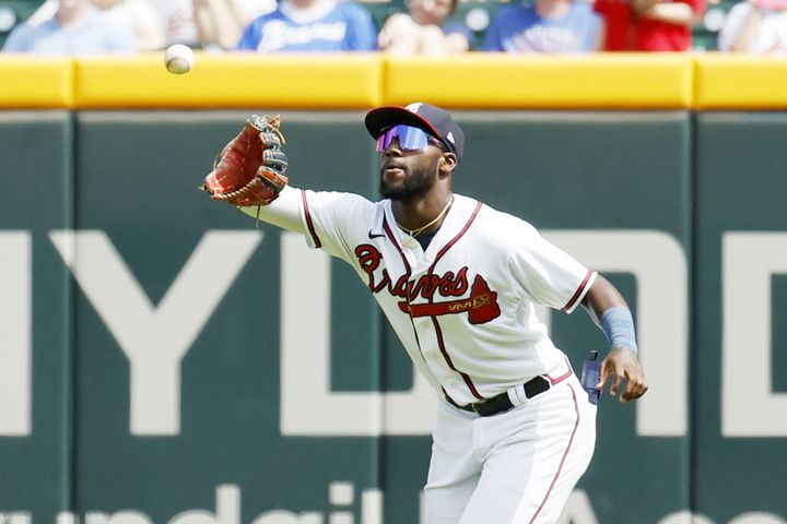 Braves center fielder Michael Harris grabs a fly ball during the sixth inning against the Astros on Sunday at Truist Park. (Miguel Martinez / miguel.martinezjimenez@ajc.com)
