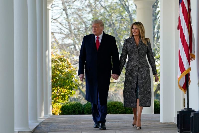 FILE - President Donald Trump and first lady Melania Trump walk out of the Oval Office and towards the Rose Garden of the White House, Nov. 24, 2020, in Washington, to pardon Corn, the national Thanksgiving turkey. (AP Photo/Susan Walsh, File)