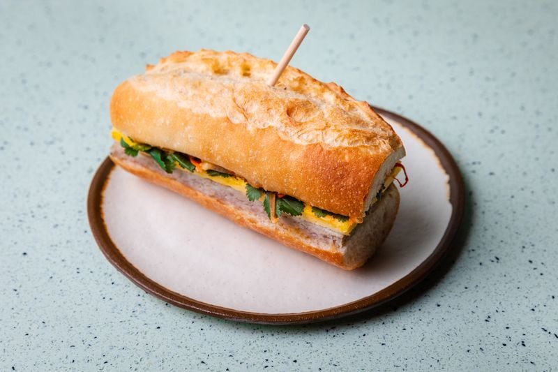 The Breakfast Banh Mi at Juniper Cafe features house-made pork sausage  seasoned with lemongrass, ginger, and garlic, hoisin and honey. Photo by Eric Sun