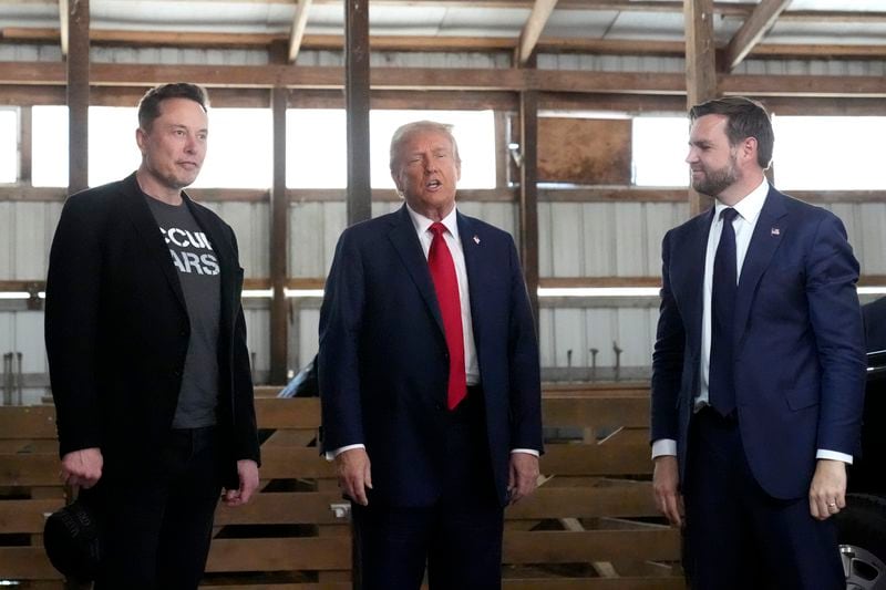 Tesla and SpaceX CEO Elon Musk, from left, Republican presidential nominee former President Donald Trump and Republican vice presidential nominee Sen. JD Vance, R-Ohio, attend a campaign event at the Butler Farm Show, Saturday, Oct. 5, 2024, in Butler, Pa. (AP Photo/Alex Brandon)