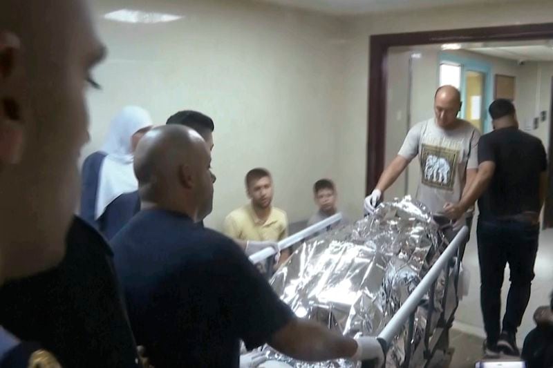 This image taken from an Associated Press video shows Aysenur Ezgi Eygi's body being transported through the Rafidia Surgical Hospital, where she was taken after she was fatally shot by Israeli soldiers, Sept. 6, 2024, in the West Bank city of Nablus. (AP Photo/Aref Tufaha)