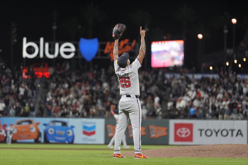 Atlanta Braves pitcher Raisel Iglesias (26) celebrates after the Braves defeated the San Francisco Giants in 10 innings of a baseball game in San Francisco, Tuesday, Aug. 13, 2024. (AP Photo/Jeff Chiu)