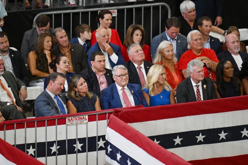 Georgia Republican lawmakers listen as former President Donald Trump speaks during a rally in Atlanta on Saturday.