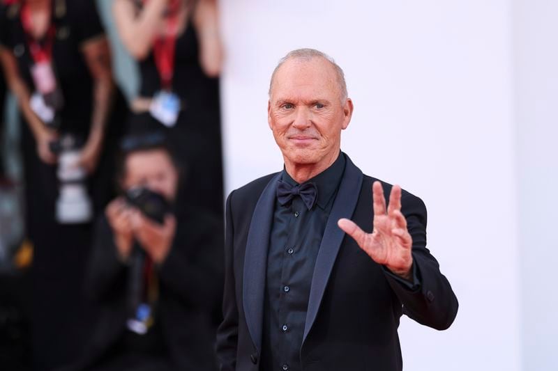 Michael Keaton poses for photographers upon arrival for the premiere of the film 'Beetlejuice Beetlejuice' and the opening ceremony of the 81st edition of the Venice Film Festival in Venice, Italy, on Wednesday, Aug. 28, 2024. (Photo by Vianney Le Caer/Invision/AP)