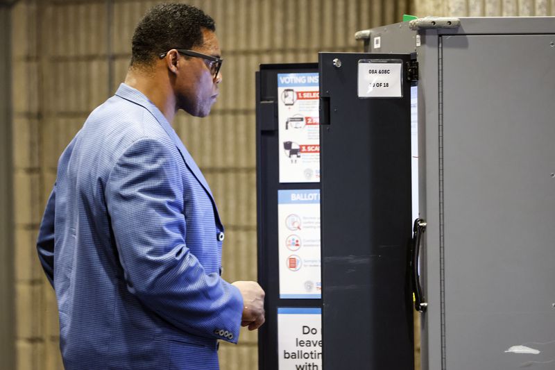 Republican U.S. Senate candidate Herschel Walker casts his ballot at Sutton Middle School on Tuesday, May 24, 2022. (Natrice Miller / natrice.miller@ajc.com)