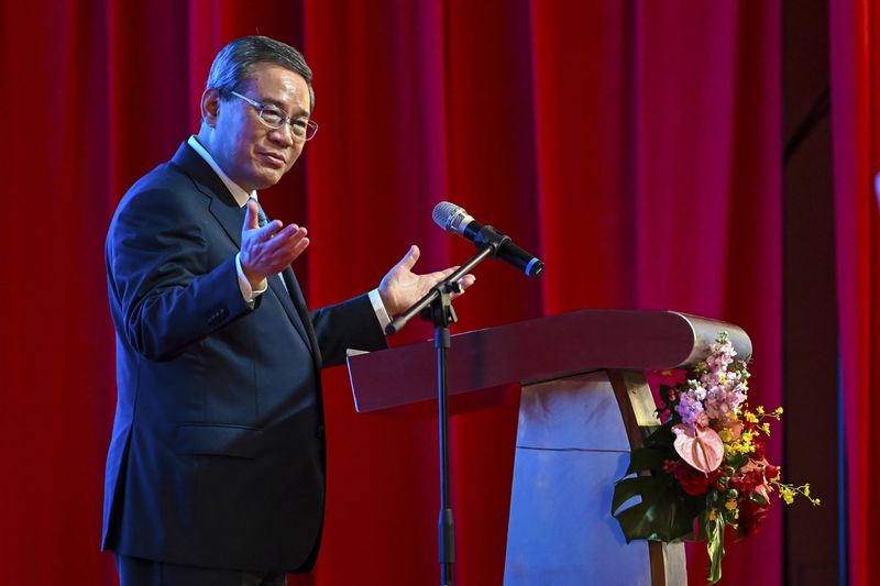 In this photo released by Malaysia's Department of Information, China's Premier Li Qiang speaks during a business luncheon with Malaysian Prime Minister Anwar Ibrahim at a hotel in Kuala Lumpur, Malaysia, Thursday, June 20, 2024. (Malaysia's Department of Information via AP)