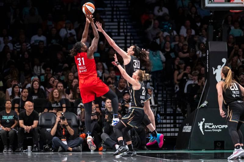 New York Liberty forward Breanna Stewart (30) defends Atlanta Dream center Tina Charles (31) during the first half of a WNBA basketball first-round playoff game Sunday, Sept. 22, 2024, in New York. (AP Photo/Corey Sipkin)