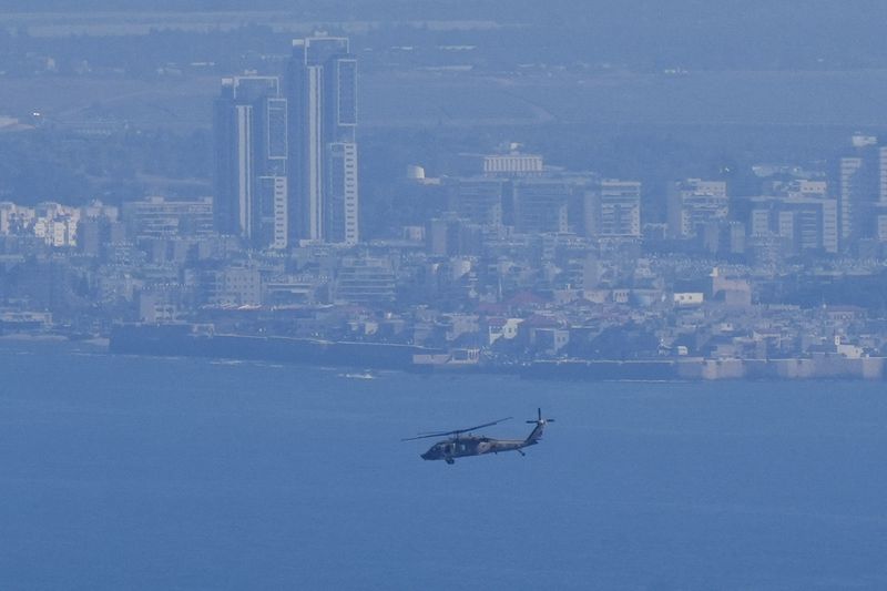 An Israeli Air Force Black Hawk helicopter flies over the Mediterranean Sea near the northern Israeli city of Kiryat Yam, Thursday, Sept. 26, 2024. (AP Photo/Baz Ratner)