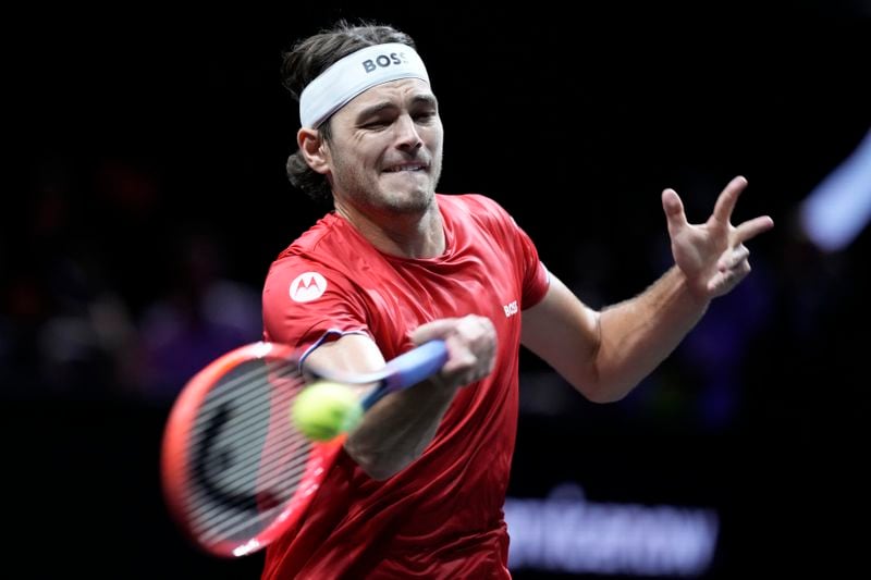 Team World's Taylor Fritz returns to Team Europe's Carlos Alcaraz on the third day of the Laver Cup tennis tournament, at the Uber arena in Berlin, Germany, Sunday, Sept. 22, 2024. (AP Photo/Ebrahim Noroozi)