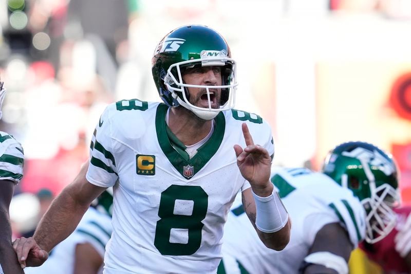 New York Jets quarterback Aaron Rodgers (8) signals toward teammates during the first half of an NFL football game against the San Francisco 49ers in Santa Clara, Calif., Monday, Sept. 9, 2024. (AP Photo/Godofredo A. Vásquez)