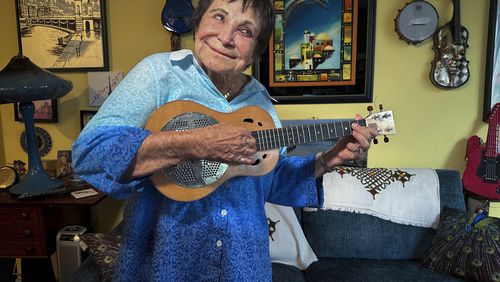 FILE - D'yan Forest, 89, who holds the Guinness World Record for Oldest Working Female Comedian, poses in her apartment, Thursday, July 19, 2024, in New York. Forest is recovering after being randomly punched and knocked to the ground while waiting to cross a street in New York earlier this month.(AP Photo/Ted Shaffrey, File)