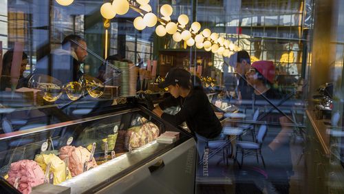 FILE - People working at a gelato shop serve customers in New York on February 18, 2024. Small businesses are increasingly concerned about payment fraud according to a survey from regional bank KeyBank. (AP Photo/Ted Shaffrey, File)