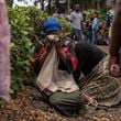 Women grieve at the port of Goma, Democratic Republic of Congo, after a ferry carrying hundreds capsized on arrival Thursday, Oct. 3, 2024. (AP Photo/Moses Sawasawa)