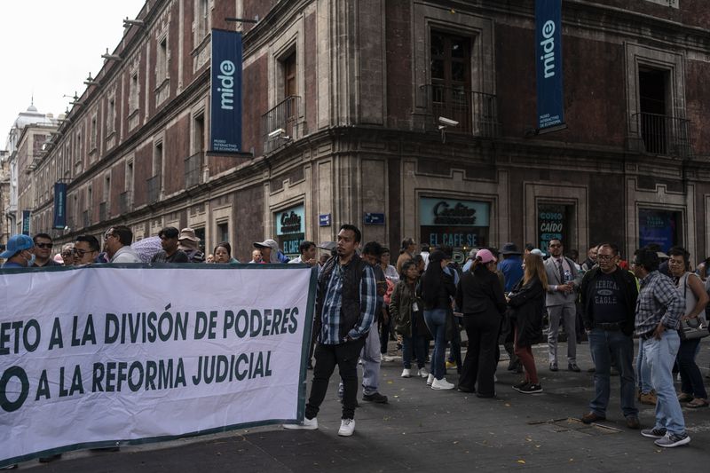 Judiciary workers protest judicial reform outside the Mexico city Congress, Thursday, Sept. 12, 2024. (AP Photo/Felix Marquez)