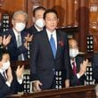 FILE - Fumio Kishida, center, is applauded after being named as Japan's prime minister at the parliament's lower house in Tokyo on Oct. 4, 2021. (Kyodo News via AP, File)