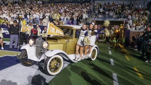 The Ramblin' Wreck leads the team onto the field before an NCAA college football game between Georgia Tech and Syracuse in Atlanta on Saturday, Nov. 18, 2023.  Georgia Tech won 31-22. (Bob Andres for The Atlanta Journal Constitution)