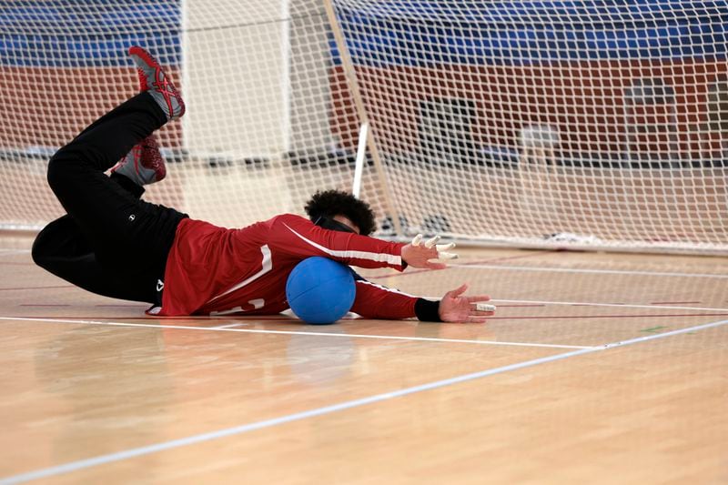 U.S. goalball athlete Zion Walker blocks a shot in practice at the U.S. team High Performance Center during the Paralympic Games in Paris on Wednesday, August 28, 2024. Team USA kept their facility open after the conclusion of the Olympic Games. (AP Photo/Mady Mertens)