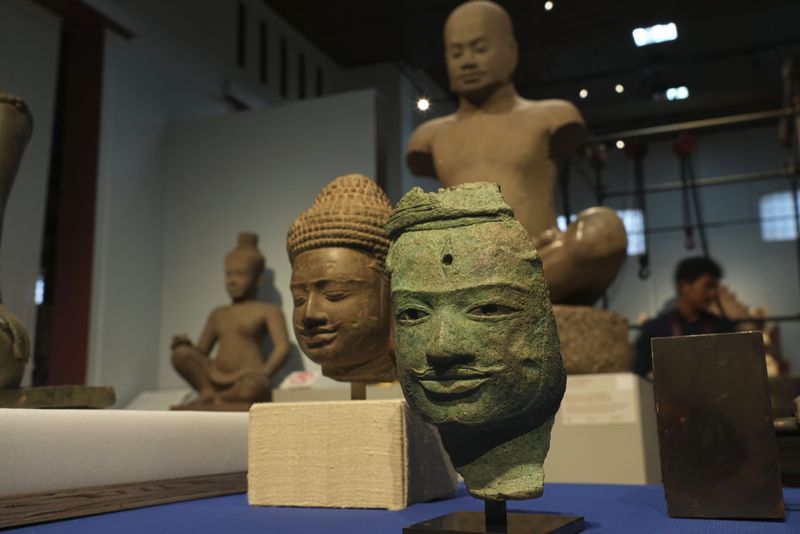 Artifact statues on display after returning from U.S to Cambodia, before an official ceremony at the Cambodian National Museum in Phnom Penh Cambodia, Thursday, July 4, 2024. Cambodia on Thursday officially organized a welcome ceremony for the arrival of more than a dozen rare Angkor era sculptures from New York's Metropolitan Museum of Art that were tied to an art dealer and collector accused of running a huge antiquities trafficking network out of Southeast Asia. (AP Photo/Heng Sinith)